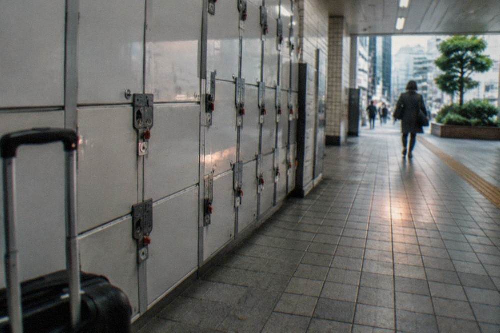 Rows of coin lockers along a station corridor wall