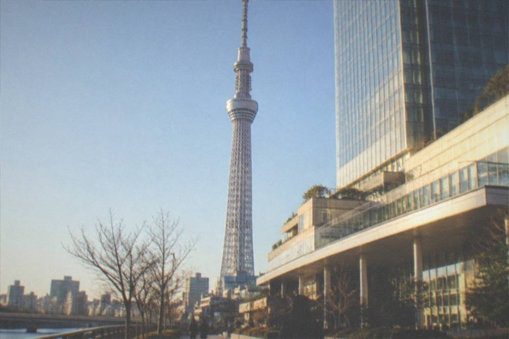 Tokyo Skytree tower rising above the Solamachi shopping complex on a clear day