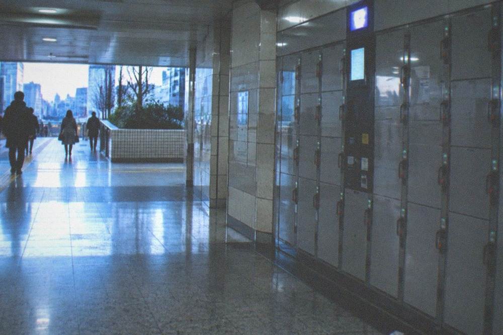 A row of lockers with a digital display showing time and price information